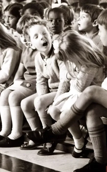 Framed Print : Boy pulling a funny face to the girl next to him. Circa 1960 Framed Print : Boy pulling a funny face to the girl next to him. Circa 1960