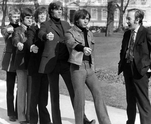 The five boys of the Bee Gees pop group began their basic training for the Army yesterday