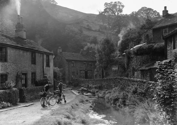 Framed Print : Two boys out on their bicycles near a stream in the Peak District village of Castletown Framed Print : Two boys out on their bicycles near a stream in the Peak District village of Castletown