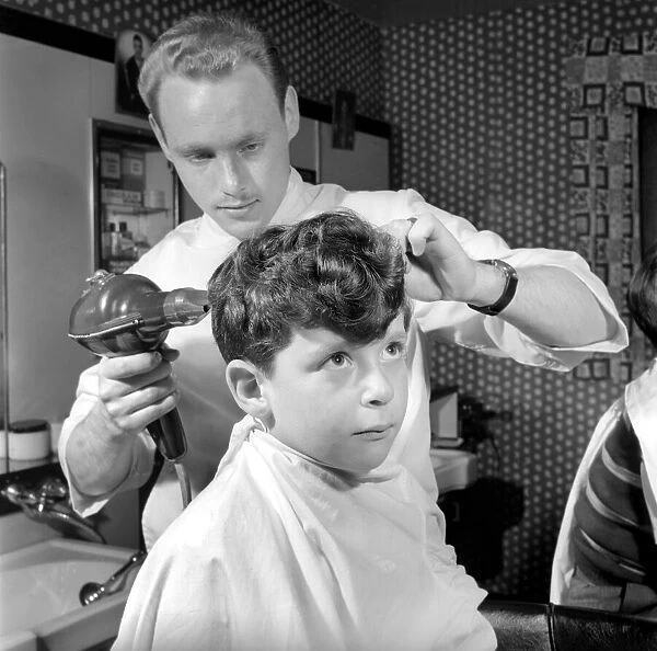 Boys Hairdressing Feature: Boys at the barbers shop. May 1956