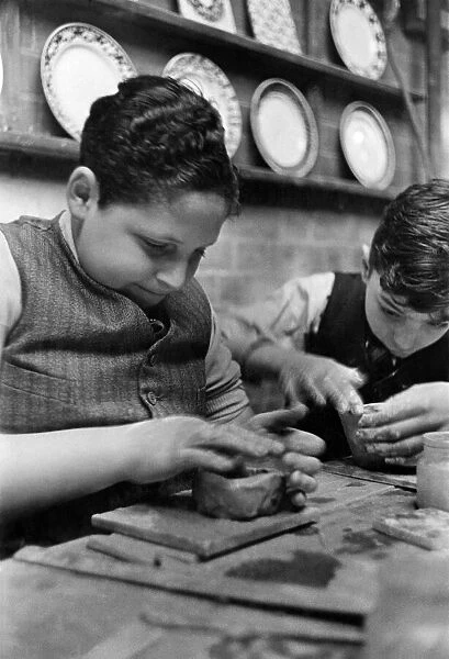 Boys make pots for the house. June 1936 P012107