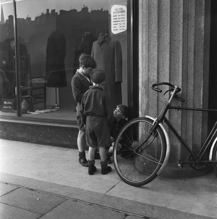 Framed Print : Boys outside a un-named clothing shop in the East End of London, 22nd February 1954 Framed Print : Boys outside a un-named clothing shop in the East End of London, 22nd February 1954