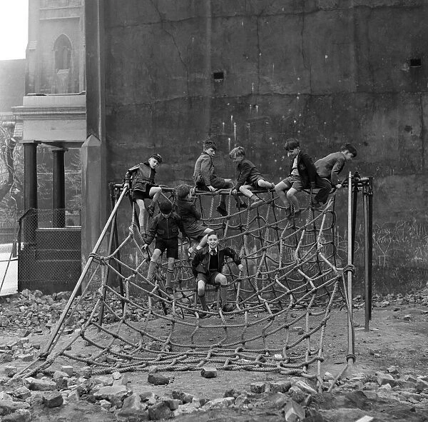 Boys playing at Clydesdale Road adventure playground. 18th May 1955