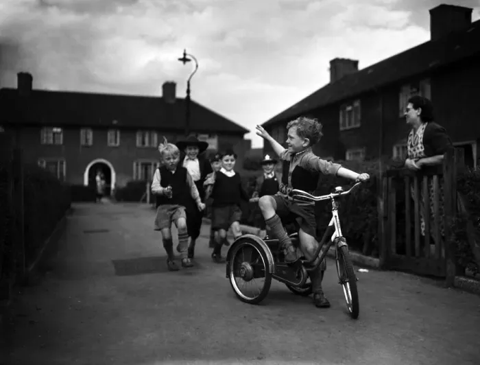 Framed Print : Boys playing on a council estate as one of their mothers looks on, London, 1955