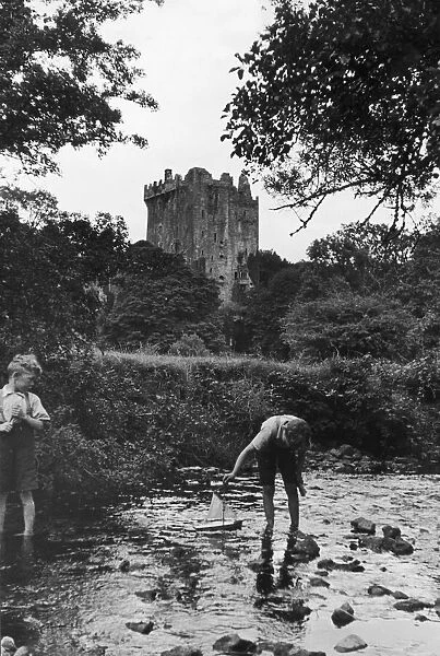 Two boys playing in the stream below Blarney Castle. 24th September 1935