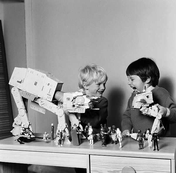 Two boys, Thomas (dark hair) and Robbin playing with their Star Wars toys