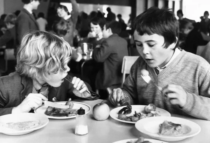 Framed Print : These boys are tucking into their school dinner Framed Print : These boys are tucking into their school dinner