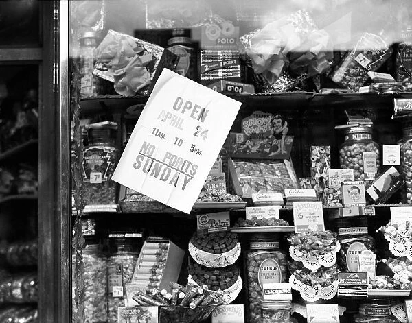 Boys visit a local sweet shop as the end of sweet rationing is enforced, 22nd April 1949