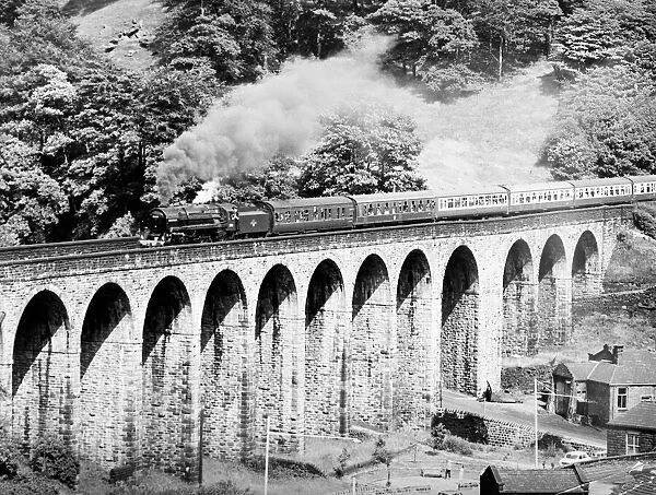 BR standard class 7 steam locomotive 70013 Oliver Cromwell crosses Lydgate viaduct