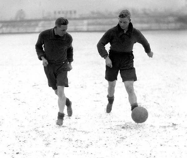 Bradford City FC. Taylor and Dickinson training in the snow. 11th February 1930