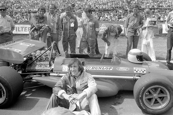 Brands Hatch. Jackie Stewart sitting beside his car before race. July 1970 70-6868-001