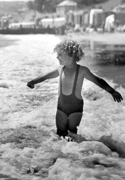 Framed Print : Brave young girl goes for a paddle in the sea while on holiday Circa 1945 Framed Print : Brave young girl goes for a paddle in the sea while on holiday Circa 1945