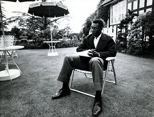 Brazilian football star Pele relaxes in an English country garden at the Brazilian team