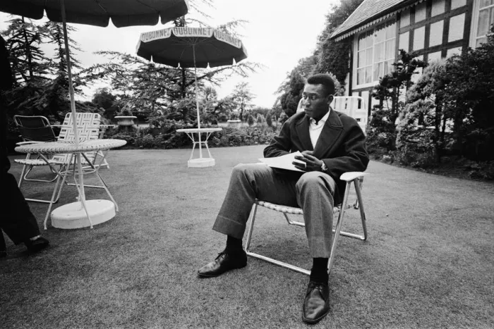 Framed Print : Brazilian football star Pele relaxes in an English country garden at the Brazilian team