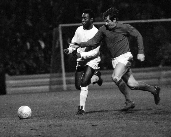 Framed Print : Brazilian football star Pele of Santos chases for the ball with Alan Mullery of Fulham Framed Print : Brazilian football star Pele of Santos chases for the ball with Alan Mullery of Fulham