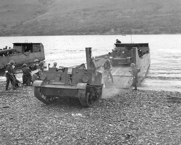 Bren carriers come off landing craft during an exercise in Scotland