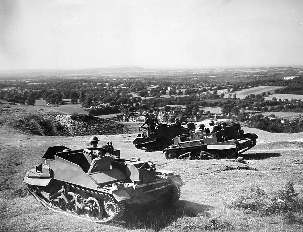 Bren Gun Carriers on patrol on the Sussex Downs, England as they keep watch for any