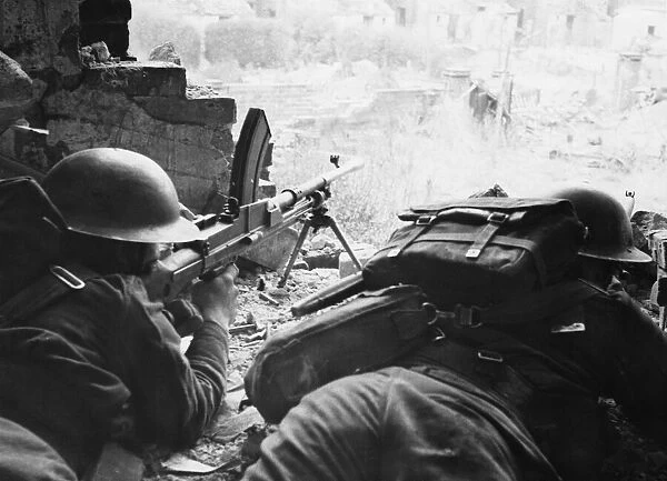 Bren Gunner and rifleman taking cover in a bombed house during training at army school