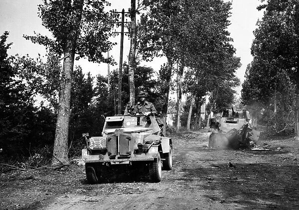 Brian and Canadian troops Falaise road push. A hidden German 88mm anti tank gun caught