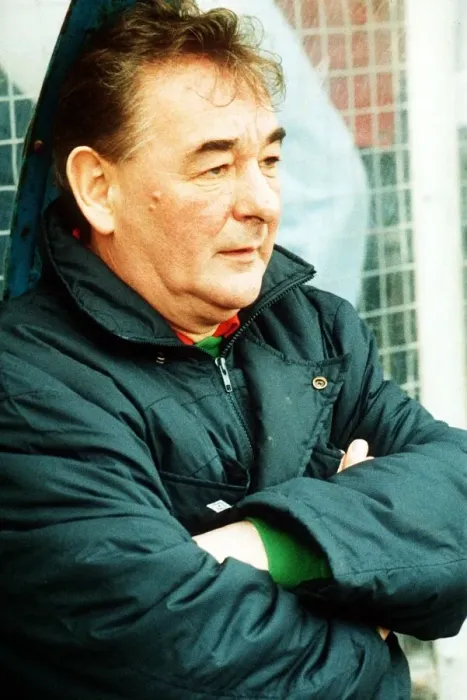 Framed Print : Brian Clough football manager sitting on team bench in football jacket with arms folded Framed Print : Brian Clough football manager sitting on team bench in football jacket with arms folded