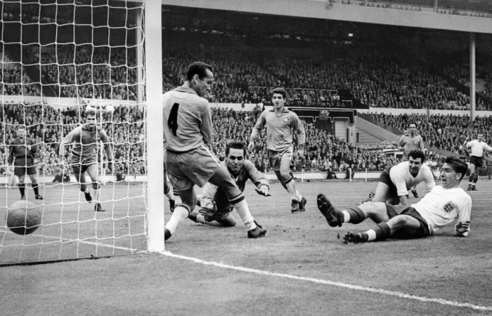 Framed Print : Brian Douglas England football player scores goal past Zequinha (No