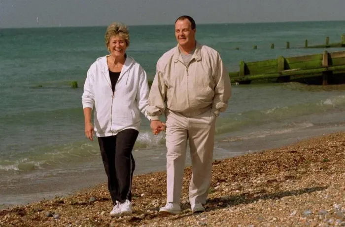 Framed Print : Brian Hill Actor who played the part of the chef in Fawlty Towers walking on the beach