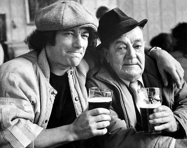 Brian Johnson lead singer of the rock group AC  /  DC shares a pint of beer with dad Alan 31