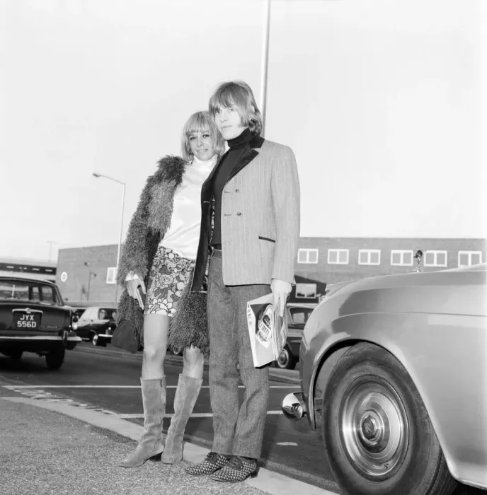 Framed Print : Brian Jones of the Rolling Stones melt his girl friend Anita Pallenberg as she arrived Framed Print : Brian Jones of the Rolling Stones melt his girl friend Anita Pallenberg as she arrived
