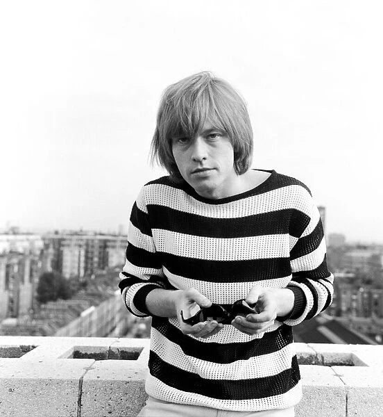 Brian Jones of The Rolling Stones poses for the camera after the single