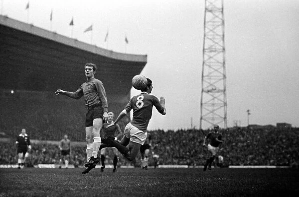 Brian Kidd of Manchester United in an aerial challenge for the ball with an Ipswich Town