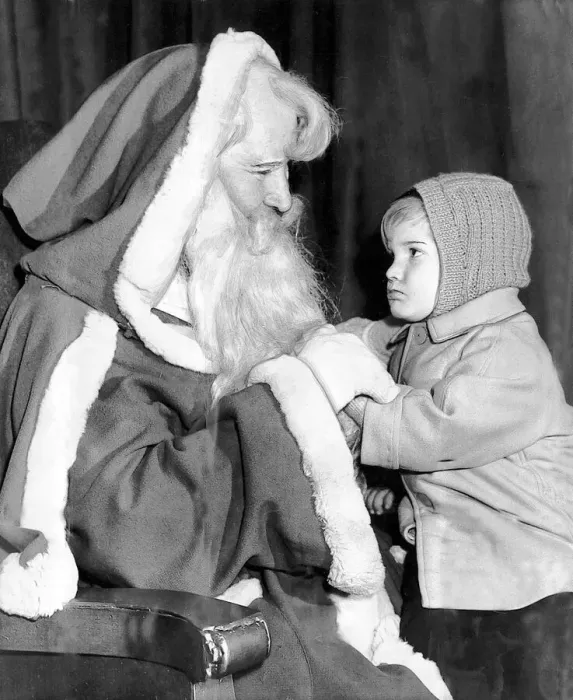 Framed Print : Brian Mace, aged two, has a chat with Santa Claus. Brian is visiting his grandmother in Framed Print : Brian Mace, aged two, has a chat with Santa Claus. Brian is visiting his grandmother in
