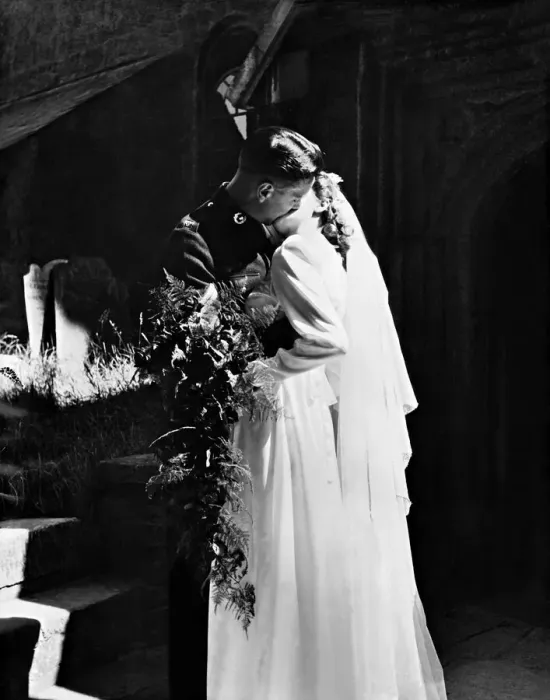 Framed Print : Bride and Groom snatch their first married kiss as they leave Stoke Damerel Church
