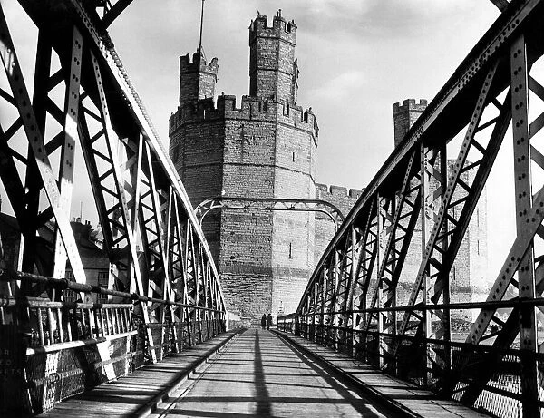 The Bridge at Caernarfon with the castle in the background. Gwynedd, Wales. Circa 1955