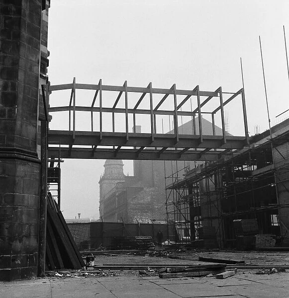 Bridge lifted into position to join old and new town hall. Circa 1971