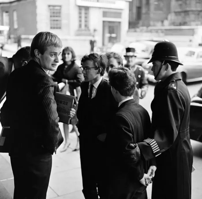 Framed Print : For a brief moment outside the Dorchester Hotel six students from Queen Mary