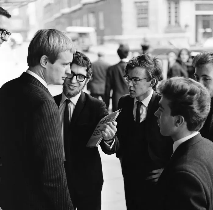 Framed Print : For a brief moment outside the Dorchester Hotel six students from Queen Mary Framed Print : For a brief moment outside the Dorchester Hotel six students from Queen Mary