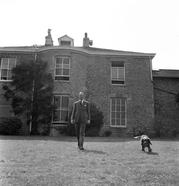 Brigadier Fitzroy Maclean at home with his dog Fury, in Yealand Conyers, Lancashire. 1949