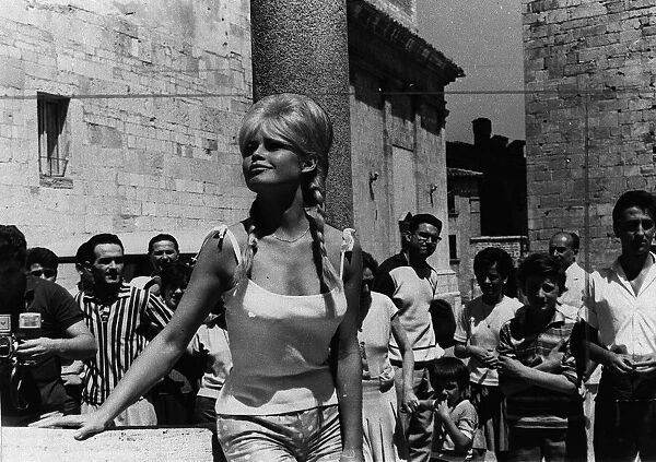 Brigitte Bardot 1961 posing for photographers in Italy for a final scene in