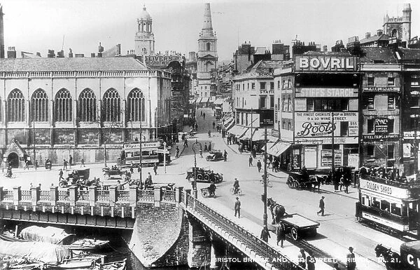 Bristol Bridge, showing trams, shops, advertising signs and St Peters Church