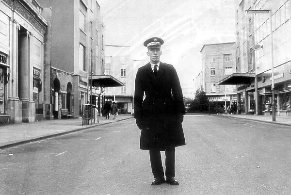 Bristol. A traffic warden surveys a traffic free Broadmead in 1973 as the road becomes a