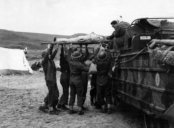British 8th Army amphibious vehicles 'Ducks'being loaded with casualties by