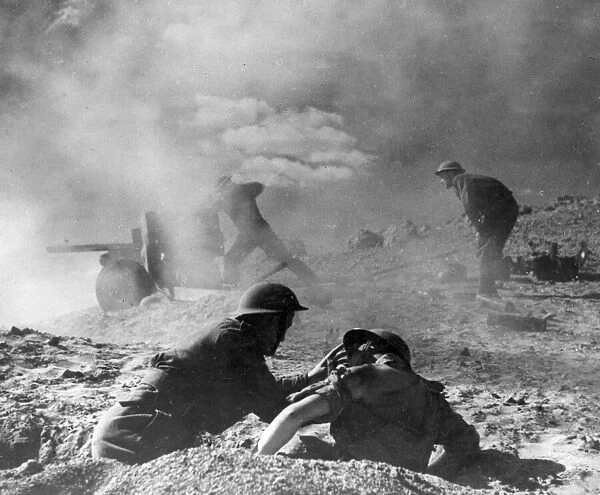 A British 8th Army (Desert Rats) 6 pounder artillery piece in action in the North