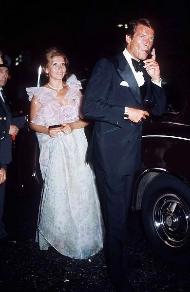 British actor Roger Moore with his wife at the Premiere Live