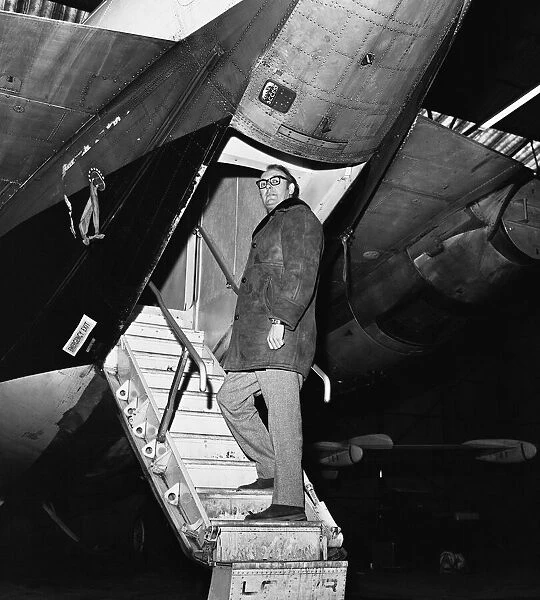 British airline entrepreneur Freddie Laker pictured beside one of his planes