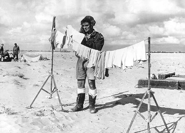 British airman hangs out his washing in the Western Desert North Africa during WW2
