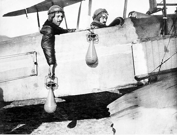 British airmen drop handbombs from their bi-plane. 1914 World War One