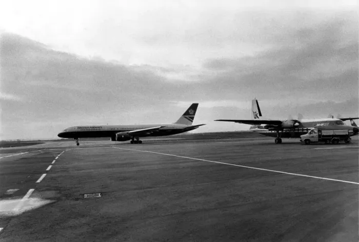 Framed Print : A British Airways 757 taxis past an Air UK Fokker F27 at Heathrow Airport