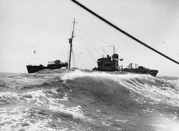 The British armed trawler KINGSTON AMBER battles through heavy seas near Scarpa Flow