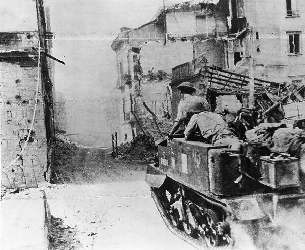 British army in a Bren Gun Carrier driving through Salerno