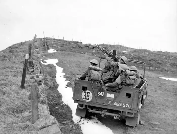 Framed Print : British army soldiers on the back of an all terrain vehicle with mounted Bren gun during